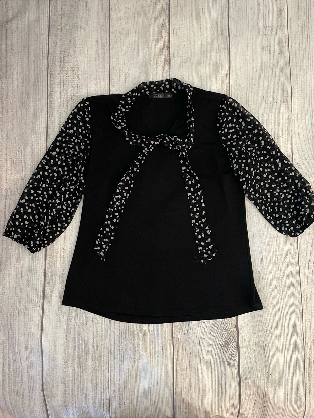 CURE Womenโs Black Tie-Neck Blouse with Printed Dotted Sleeves Size Medium